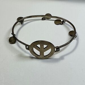 Sterling Silver peace sign bracelet with dangling round charms. 2.5” across